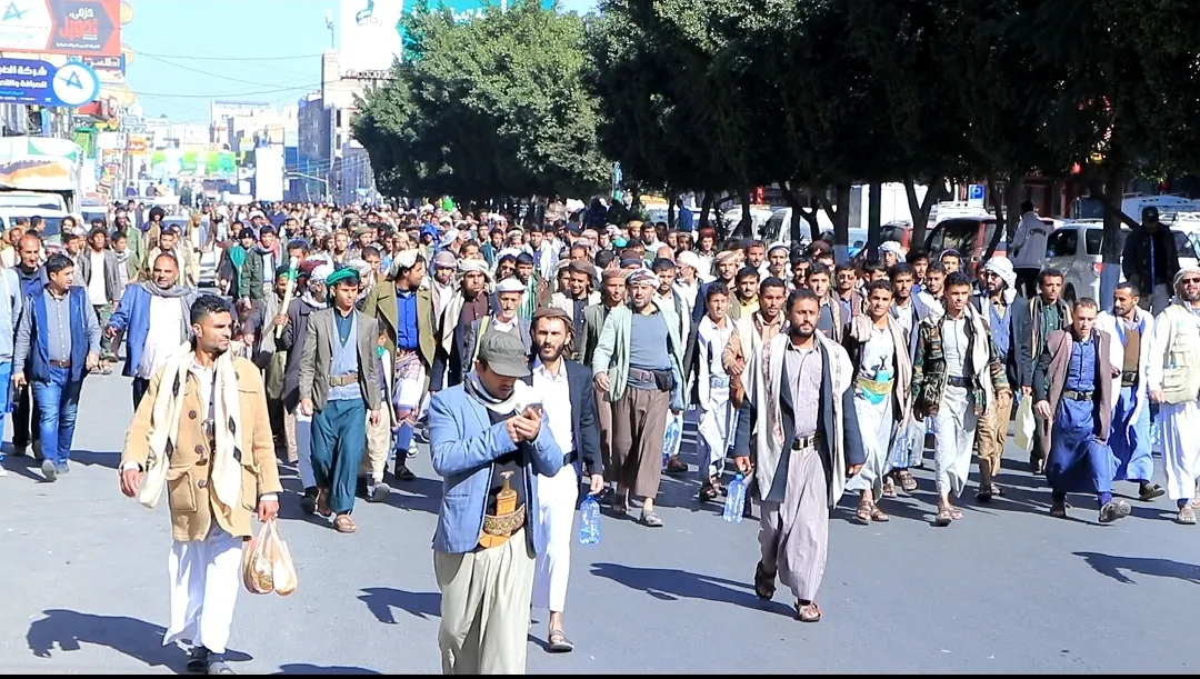 Emirates International University staff participate in the popular march of the General Mobilization Forces