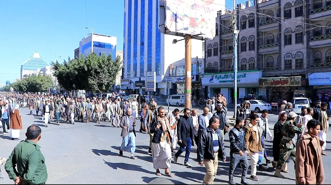Emirates International University staff participate in the popular march of the General Mobilization Forces
