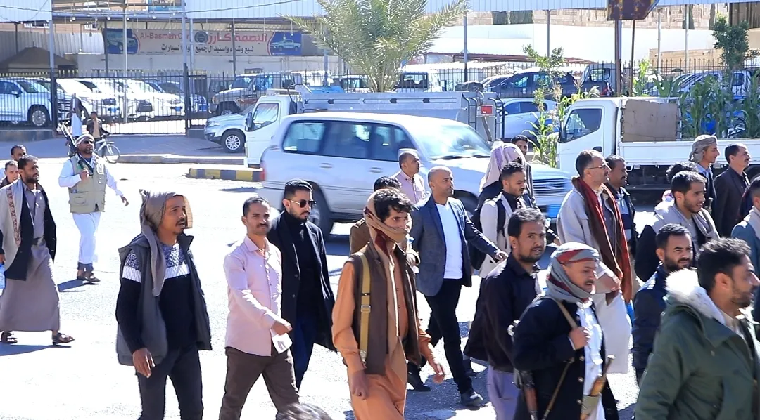 Emirates International University staff participate in the popular march of the General Mobilization Forces