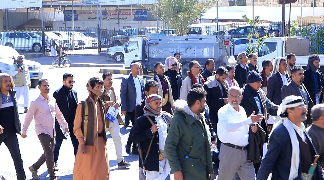 Emirates International University staff participate in the popular march of the General Mobilization Forces