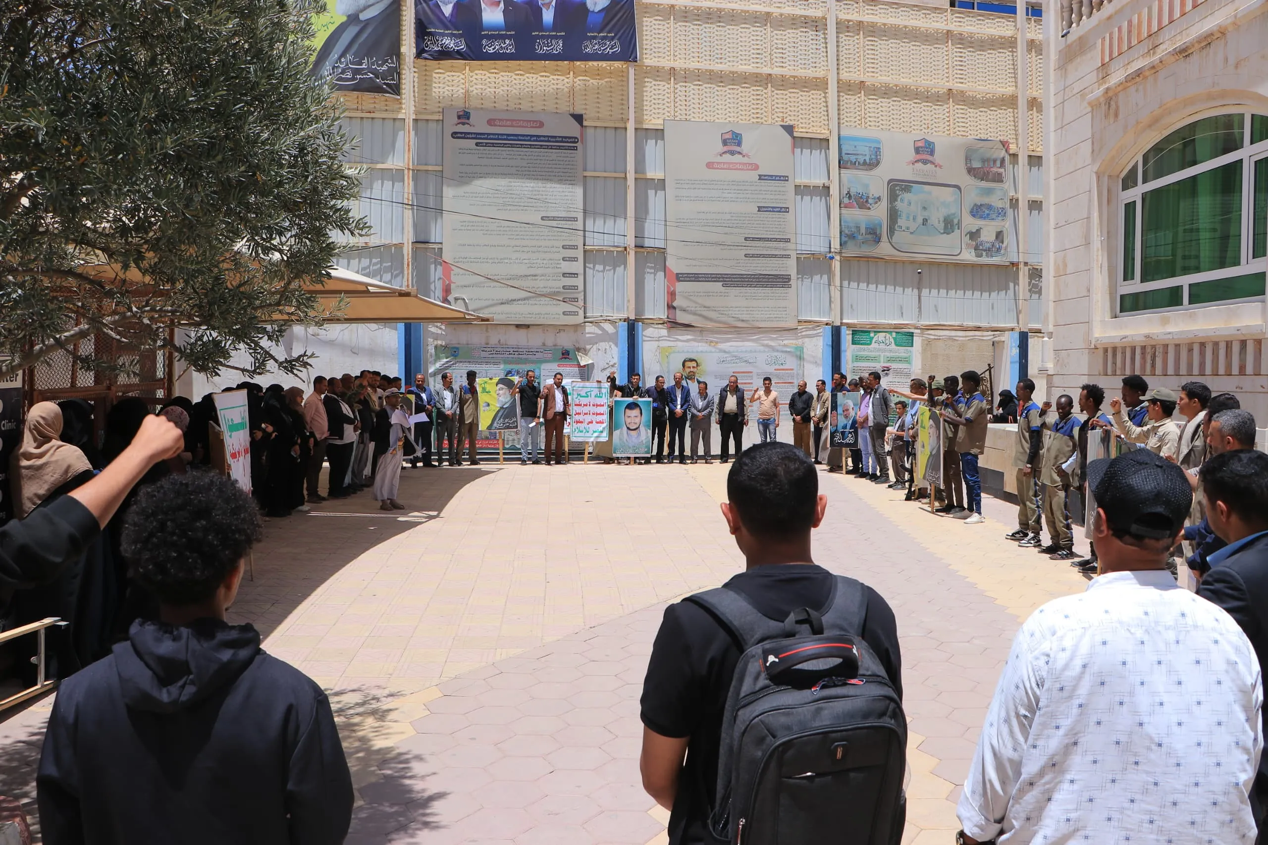 The Emirates International University organizes a solidarity stand with the Palestinian people under the slogan "With Gaza to confront genocide and starvation."