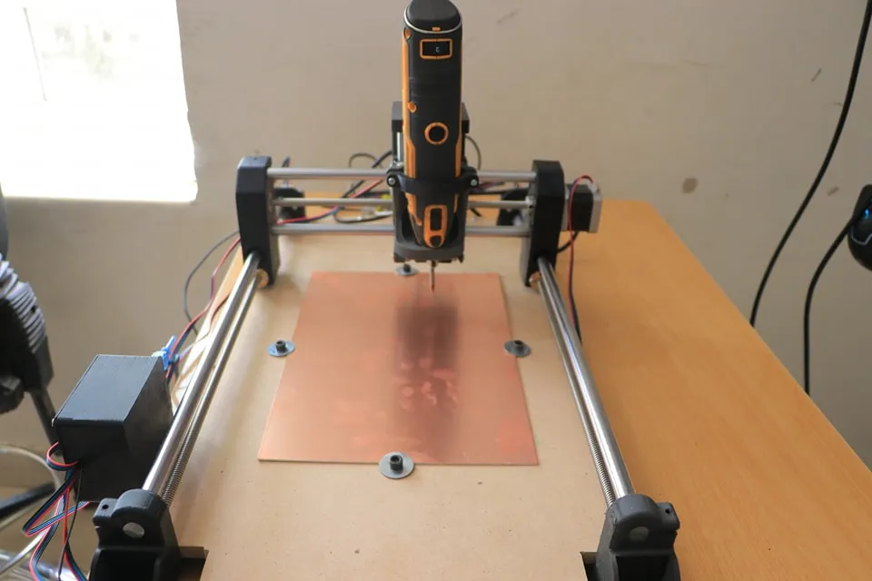 Discussion of an innovative graduation project for an advanced CNC machine for drilling electronic circuit boards for students from the Mechatronics Engineering Department.